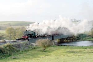 A steam train crossing the River Quoile Bridge