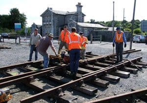 The Irish Rail and DCDR team dismantling and loading the various component parts of the turnout in Bagenalstown Railway Station yard